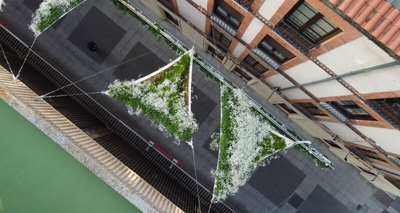 An aerial view of awnings covering a public walkway.