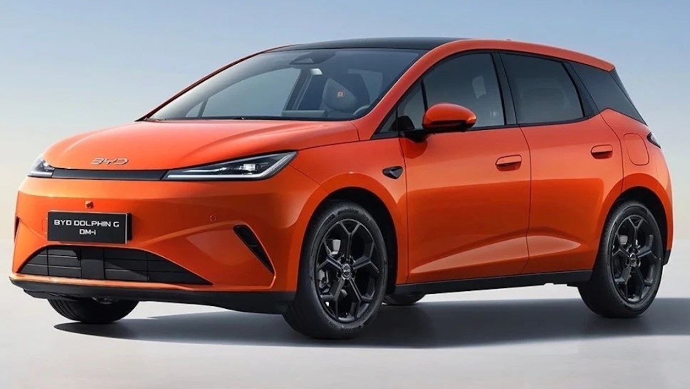 An orange BYD Dolphin electric car is showcased against a plain background.