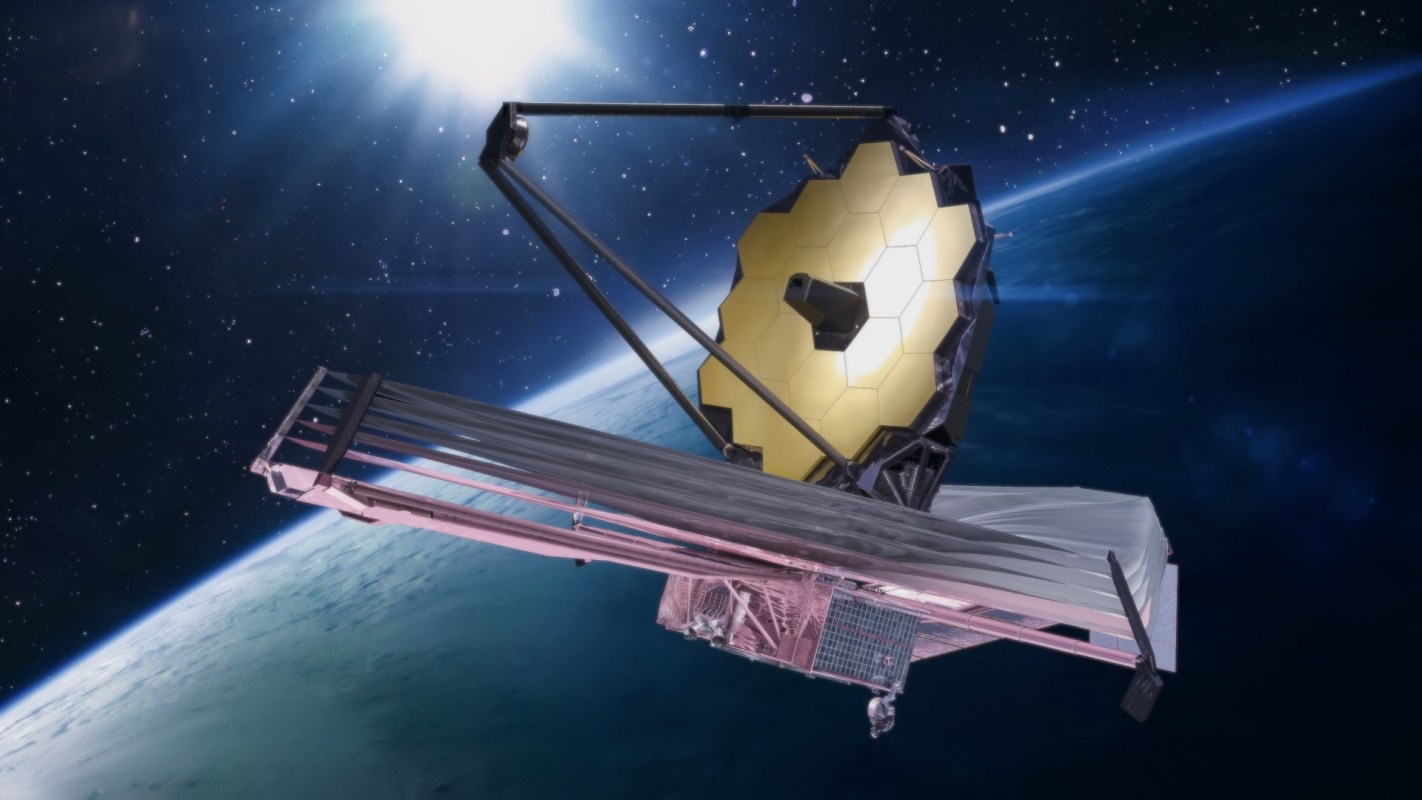 A space telescope with a large golden hexagonal mirror orbits Earth.