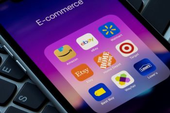 A smartphone screen displaying an "E-commerce" folder with various shopping app icons.