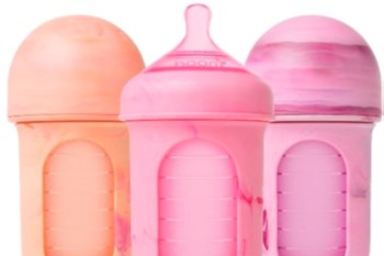 Three baby bottles, in shades of pink and orange with marbled patterns.