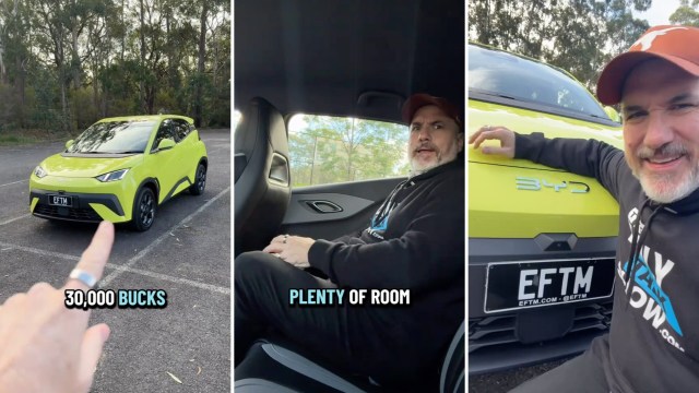 A bright yellow electric car parked in a forested area, with a person demonstrating interior space and smiling.