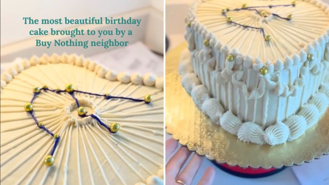 A beautifully decorated birthday cake with cream frosting, garnished with golden balls and blue swirls, on a golden platter.
