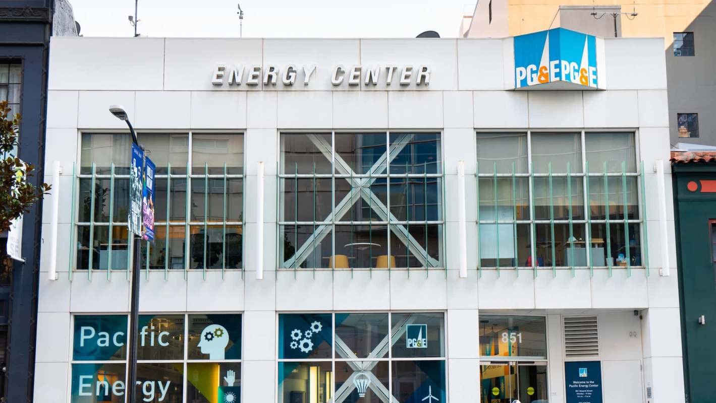 A modern building facade featuring the "Energy Center" sign and PG&E logo with large windows.
