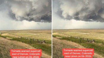 Dark storm clouds indicating a tornado warning near Limon, Colorado, with grassy fields below.