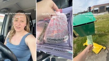 A person demonstrates a compost drop-off process holding compostable bags near a green compost bin.