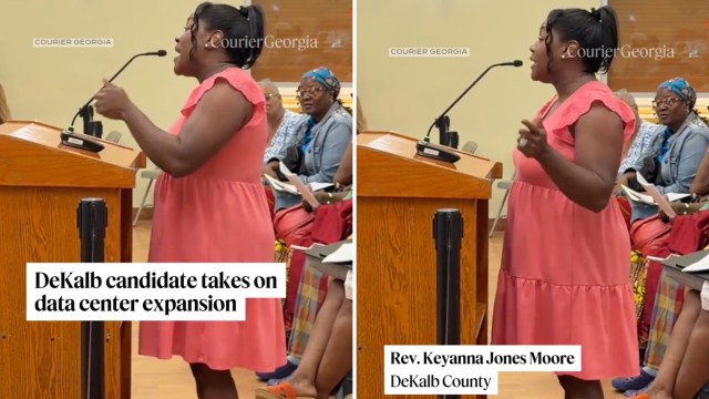 A woman in a pink dress speaks passionately at a podium during a public meeting in DeKalb County.