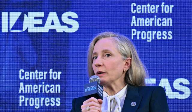 Virginia Gov. Abigail Spanberger speaks into a microphone with a blue backdrop that reads "Center for American Progress."
