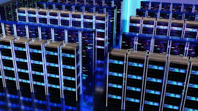 A modern data center featuring rows of servers illuminated with blue and purple lights.