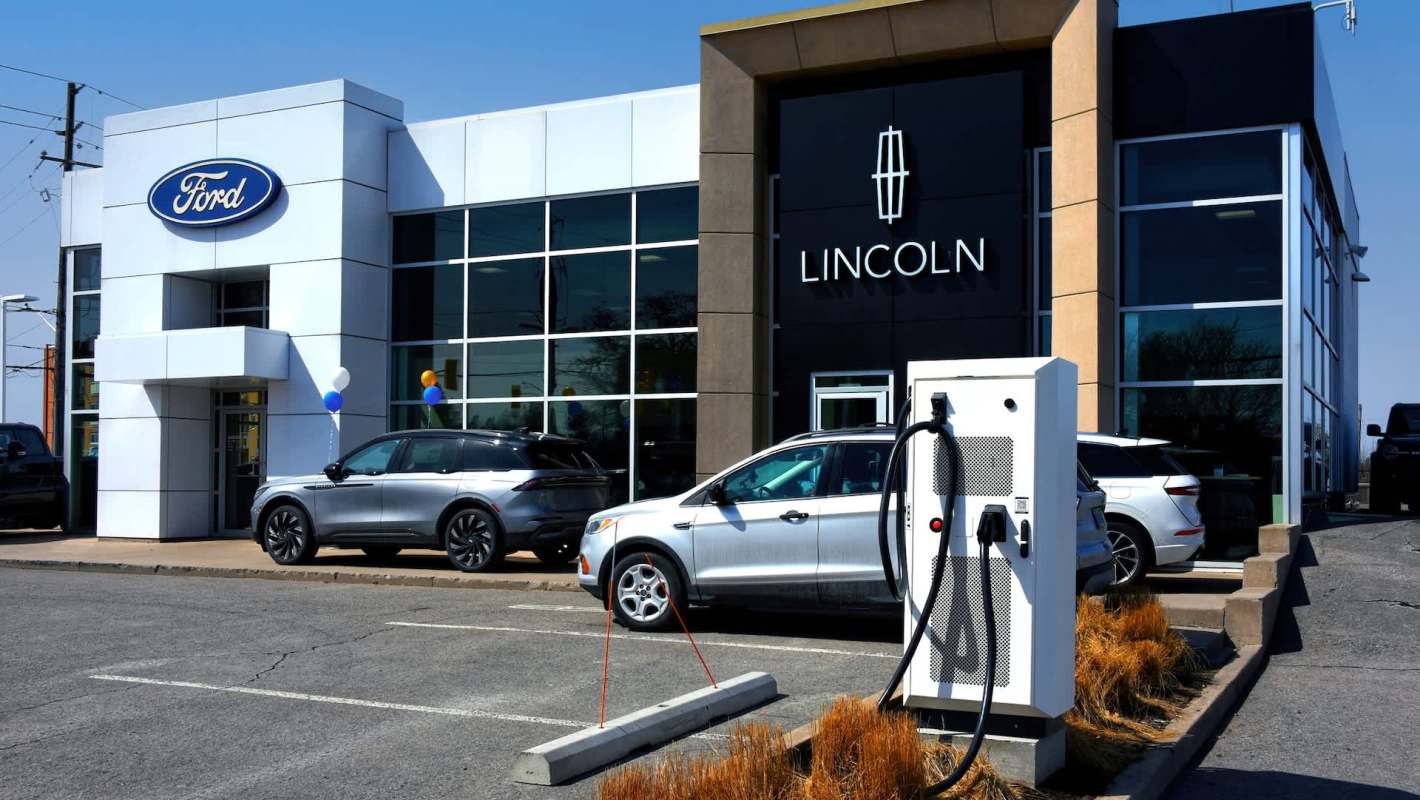 A Ford and Lincoln dealership with an EV charger.