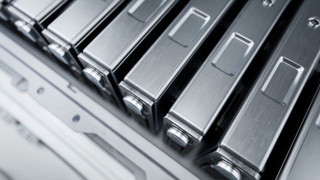 Silver battery cells arranged in a row.
