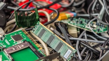A cluttered arrangement of circuit boards and tangled cables.
