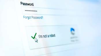 A close-up of a login screen showing a password field and a selected "I'm not a robot" checkbox.