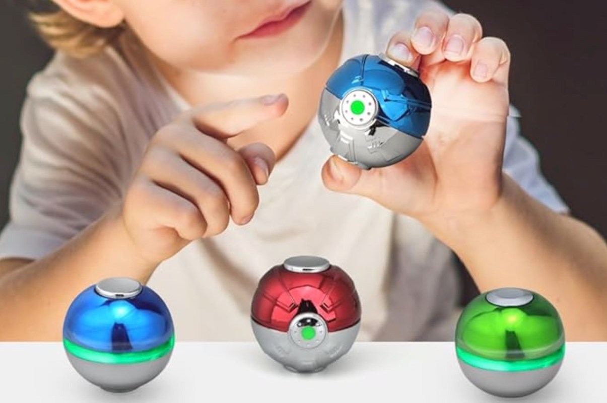 A child plays with a shiny orb.