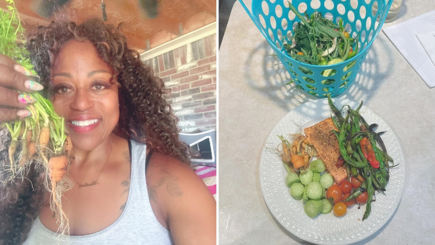 A woman holding freshly harvested carrots and a dinner plate with fish and veggies.