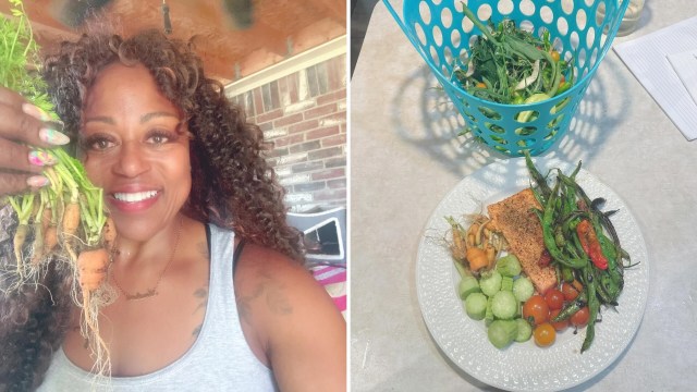 A woman holding freshly harvested carrots and a dinner plate with fish and veggies.