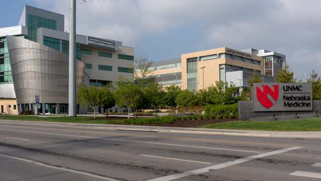 A modern medical complex featuring the UNMC Nebraska Medicine sign and the Davis Global Center.