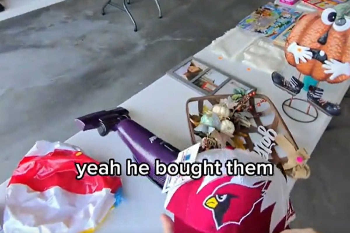 A table displaying items at a yard sale.