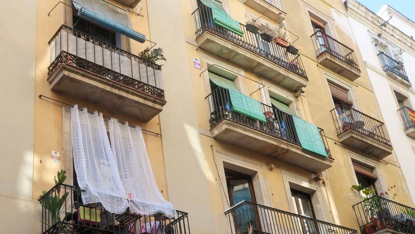 An apartment facade with balconies.