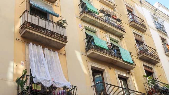 An apartment facade with balconies.
