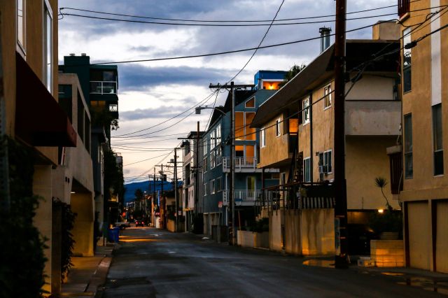An alley lined with multiunit housing at dusk in Venice, Los Angeles.