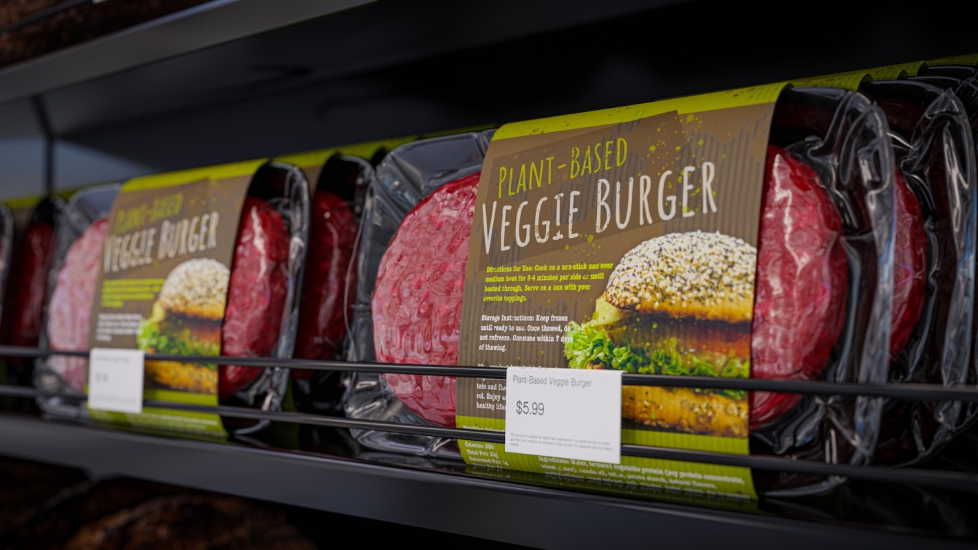 A package of plant-based veggie burgers displayed in a grocery store with a price tag of $5.99.