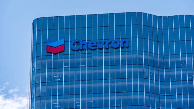 A Chevron logo on a modern glass building.