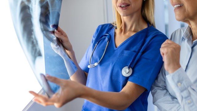 A healthcare professional discusses a lung X-ray.