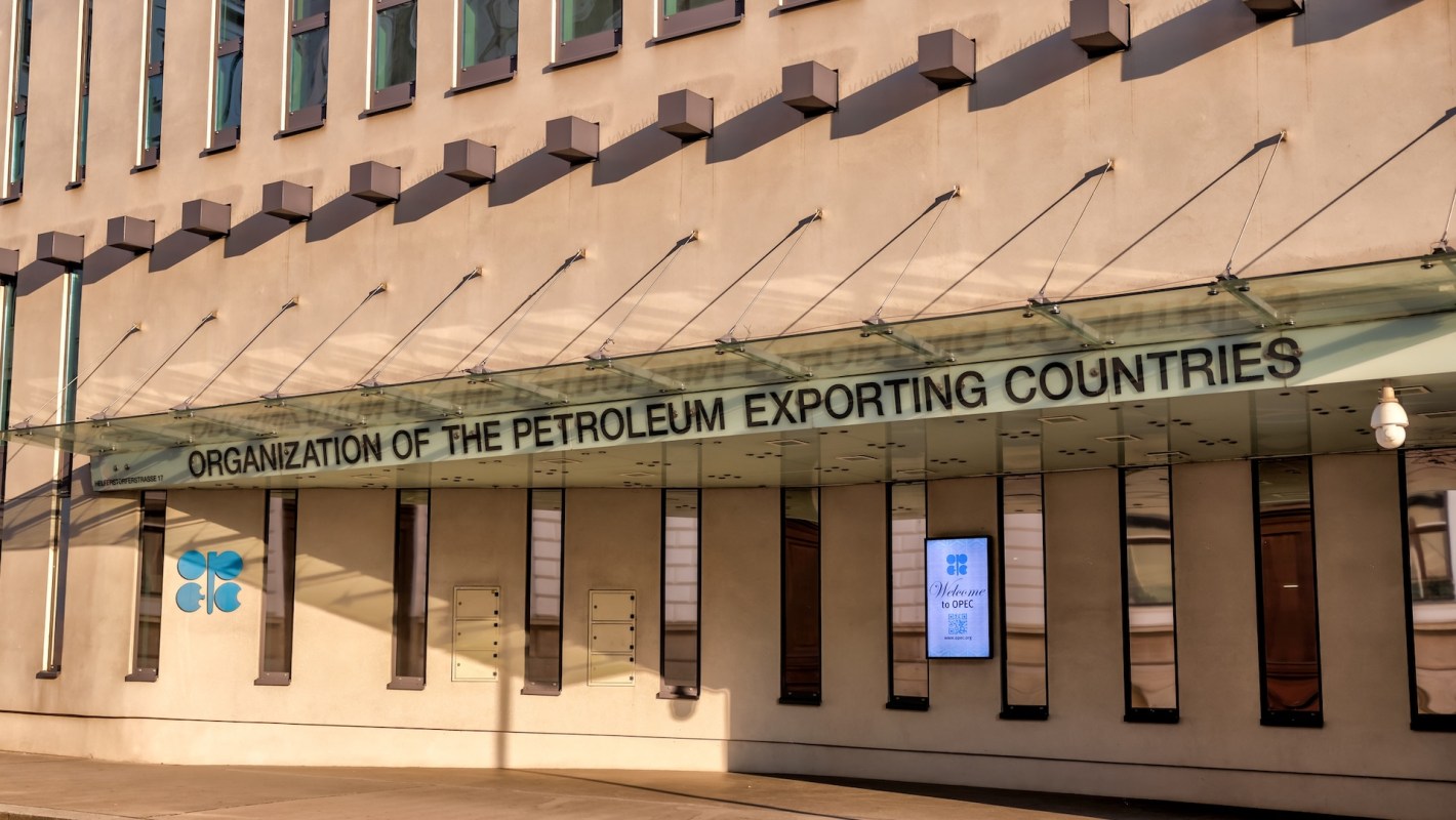 The entrance of the OPEC headquarters featuring the organization's name and a welcome sign.