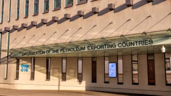 The entrance of the OPEC headquarters featuring the organization's name and a welcome sign.