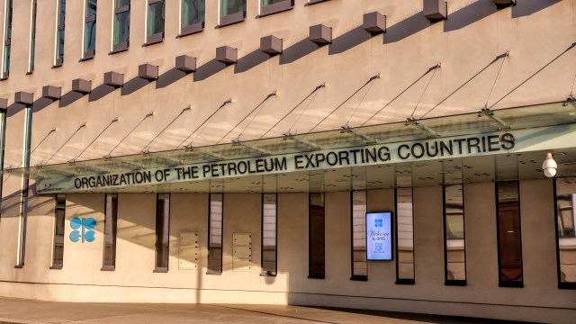 The entrance of the OPEC headquarters featuring the organization's name and a welcome sign.