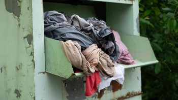Clothes in a collection bin.