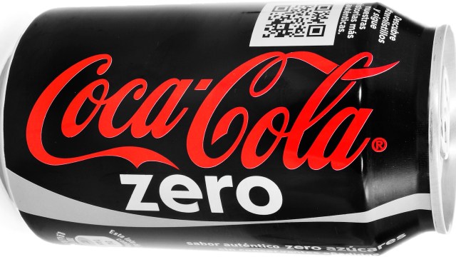 A Coca-Cola Zero can with a black background and red logo design.