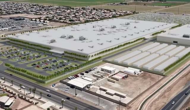 An aerial view of a large industrial facility surrounded by parking lots and nearby residential areas.