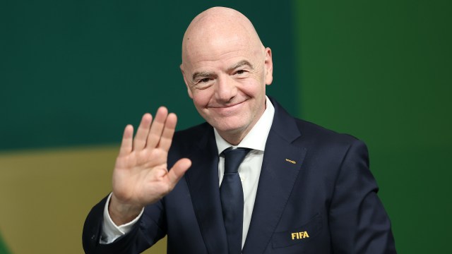 FIFA President Gianni Infantino smiles and waves.