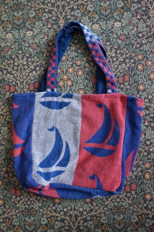 A beach bag made from an old towel.