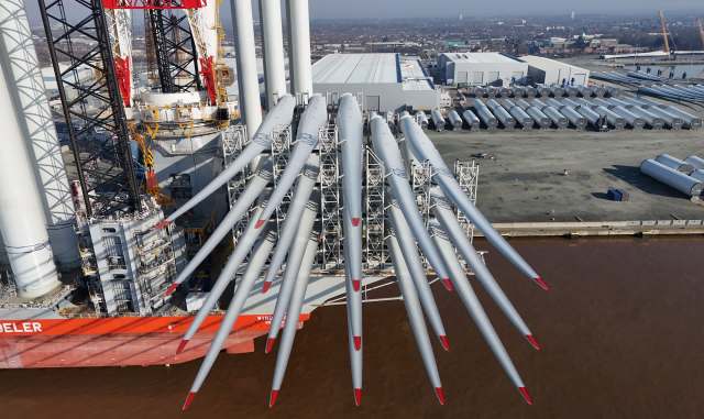 A ship with wind turbine parts.
