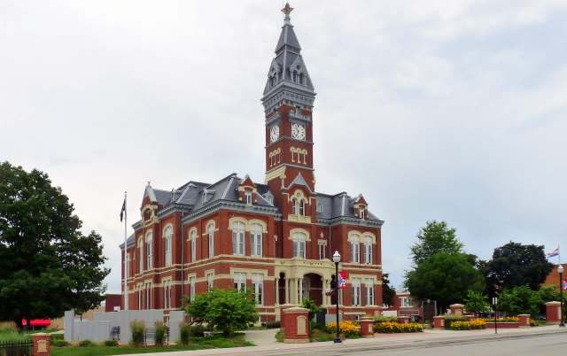 A historic brick courthouse with a clock tower.
