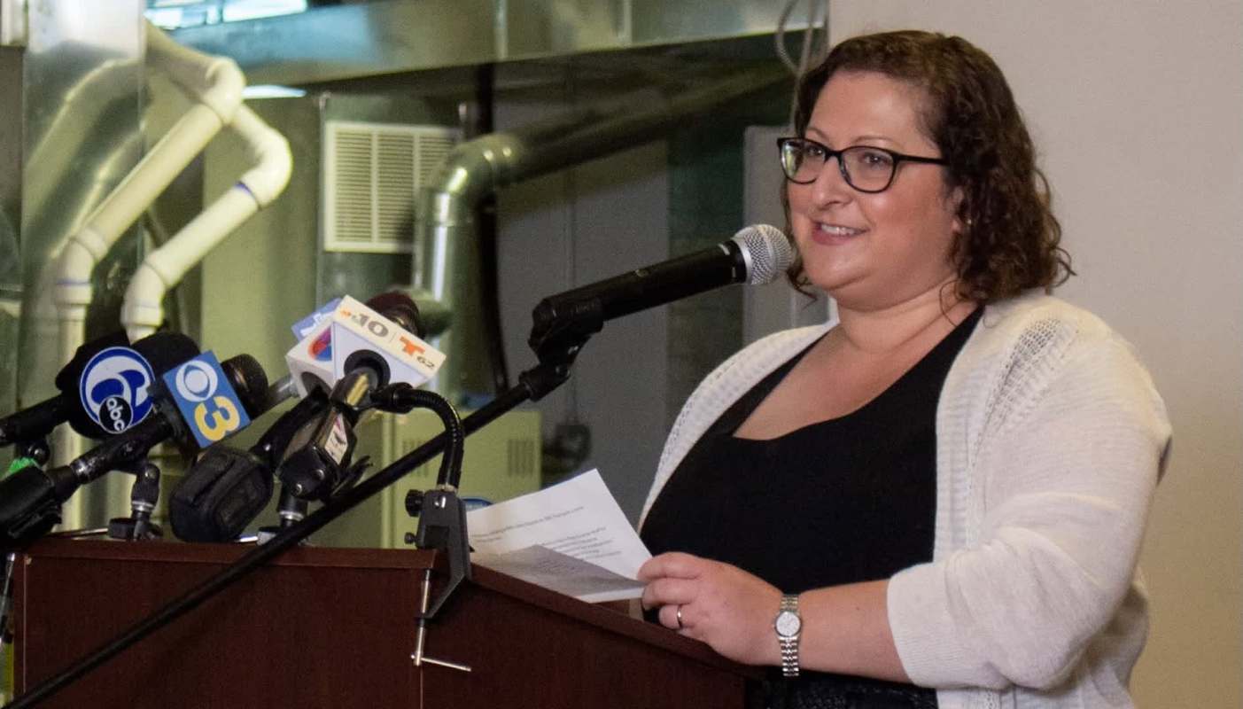 Philadelphia Energy Authority President and CEO Emily Schapira speaks at a podium.