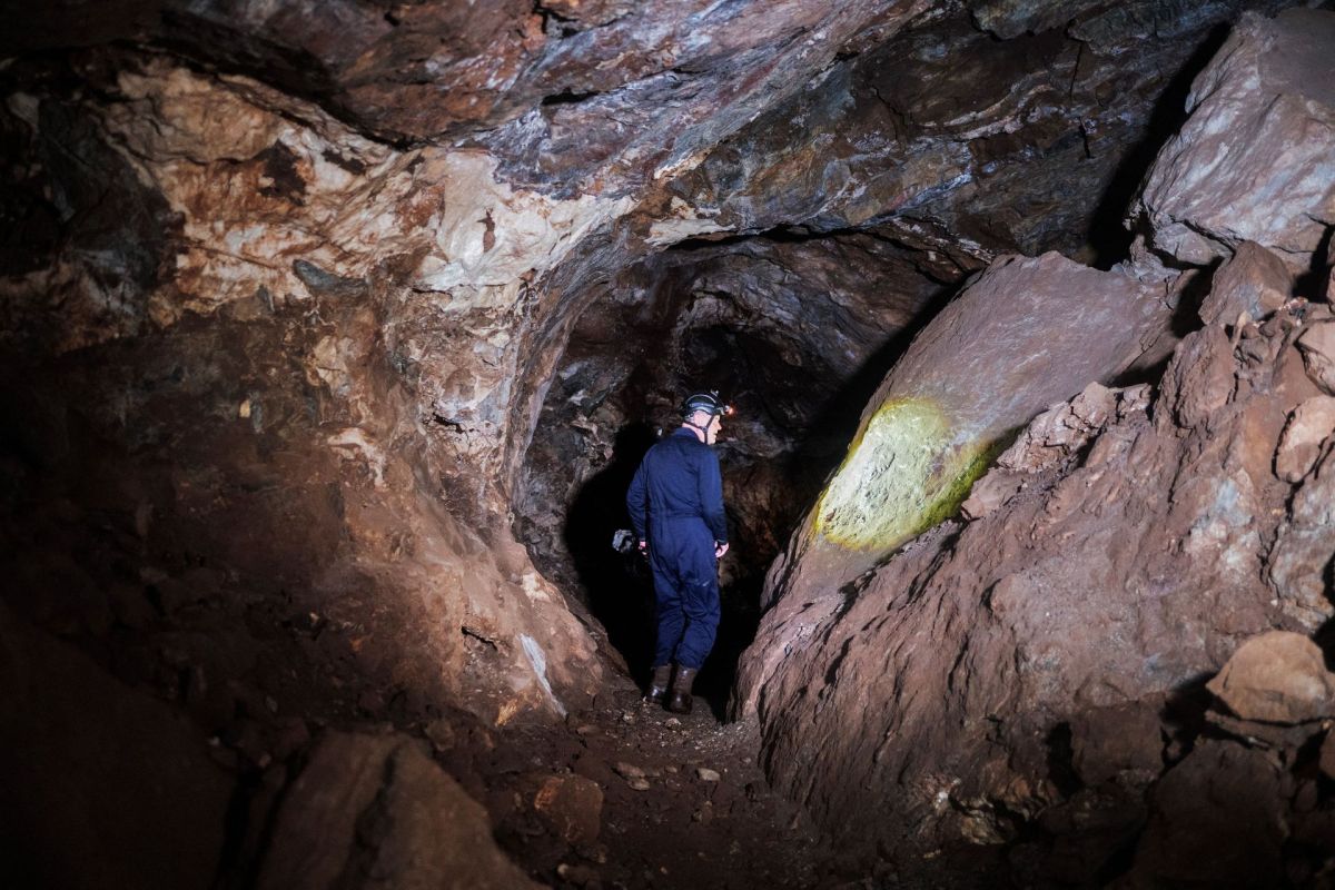 A person walking in the Rising Star cave system.