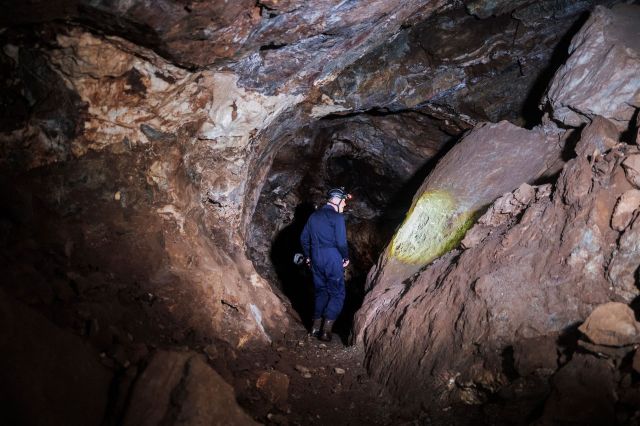 A person walking in the Rising Star cave system.