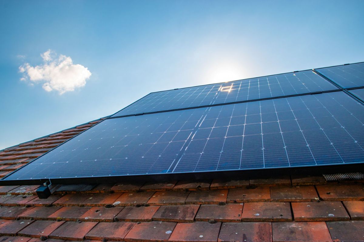 Solar panels mounted on a tiled roof.
