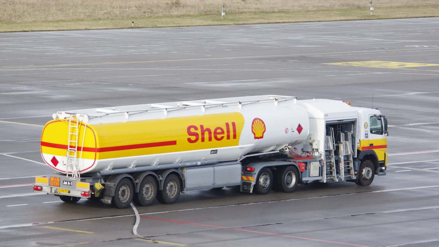 A Shell fuel truck parked on an airport tarmac.