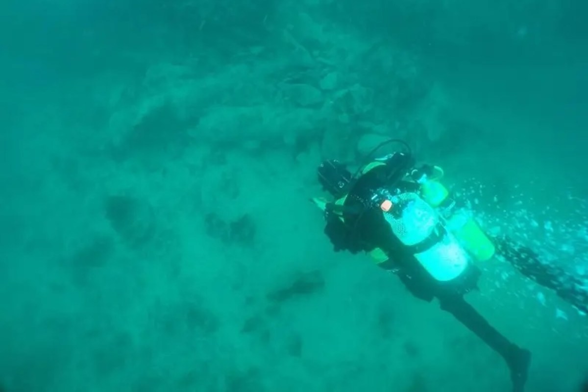 A diver exploring a shipwreck.
