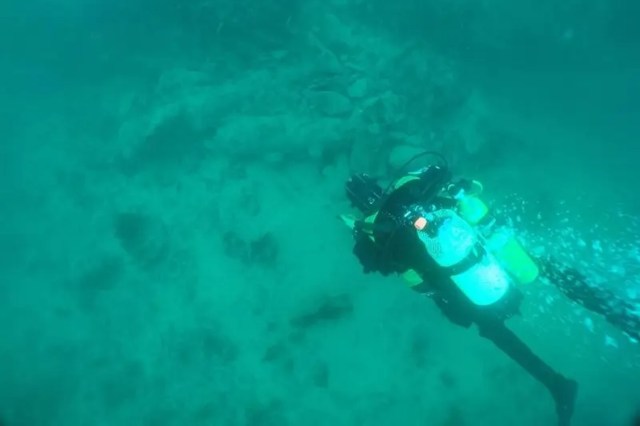 A diver exploring a shipwreck.