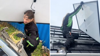 A person wearing black and green clothing installs solar panels on a roof while using a ladder.