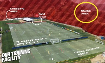 An aerial view of a soccer training facility, with the area outside it marked in red as a "snake area."