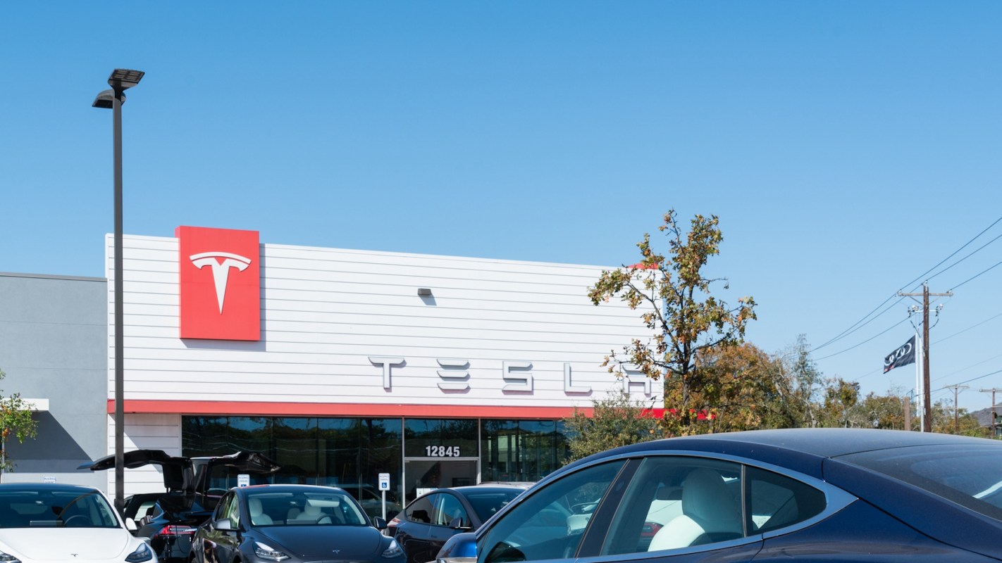 A Tesla showroom with a full outdoor lot.
