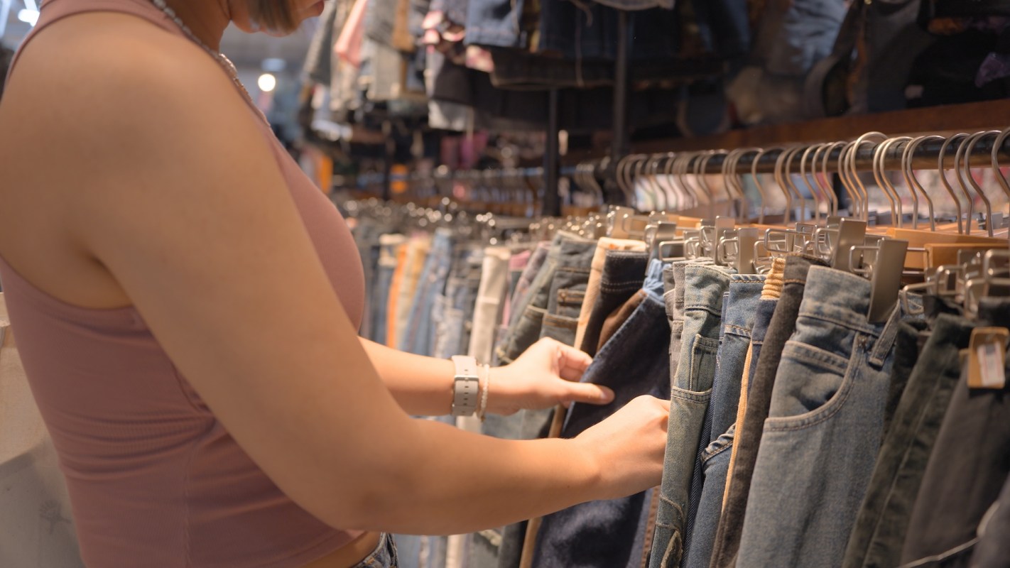 A person looking at jeans.