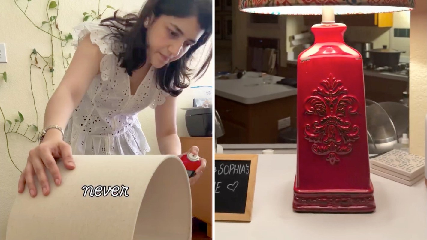 A woman in a white dress applies glue to a lamp shade in a well-lit kitchen.